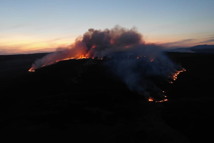 A grass fire raging into the night - captured during a Mid and West Wales Fire and Rescue Service call out this month
