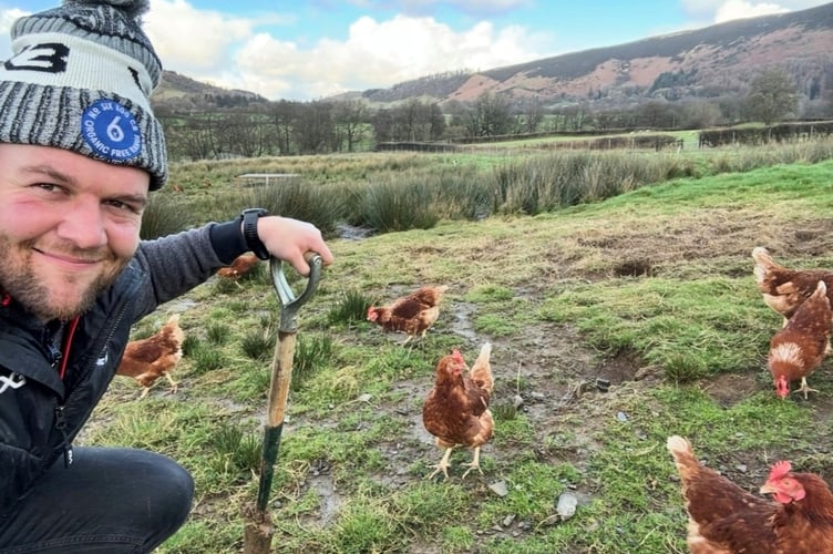 Dan Lydiate with his free-range chickens at Abbeycwmhir