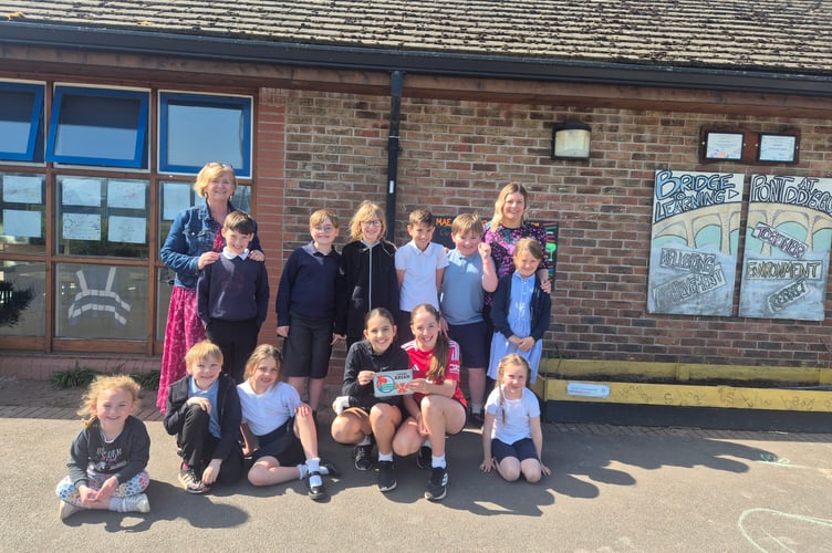 Members of Llanfaes C.P. School’s Criw Cymraeg celebrate achieving the Cymraeg Campus Silver Award