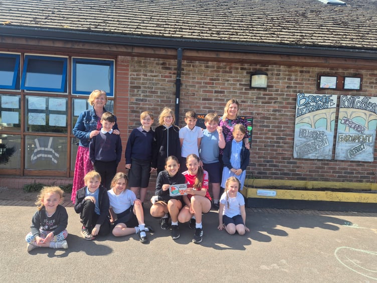 Members of Llanfaes C.P. School’s Criw Cymraeg celebrate achieving the Cymraeg Campus Silver Award