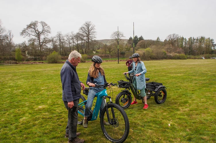 Riders out electric bikes and trikes at the launch of the Llanwrtyd Wheels project at Dolwen Fields