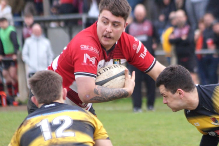 Logan McIntosh takes the ball into contact