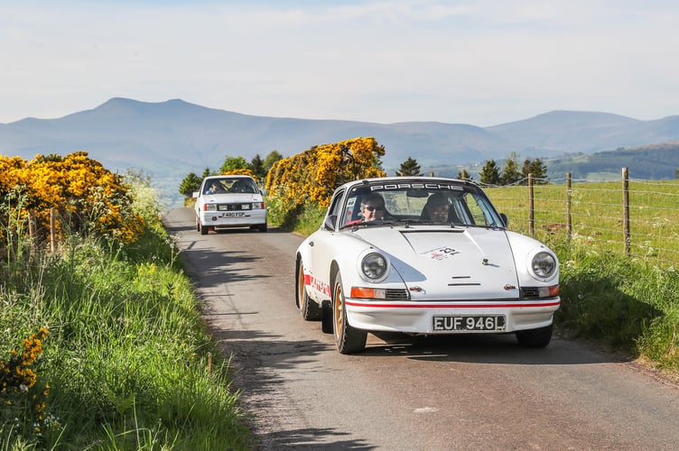 A classic Porsche leads a Vauxhall over the Battle Hill navigational section