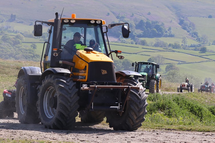Mervyn Price in his JCB Fastrax leading the procession 