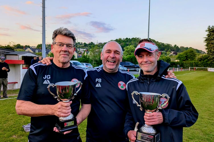 The proud coaching team