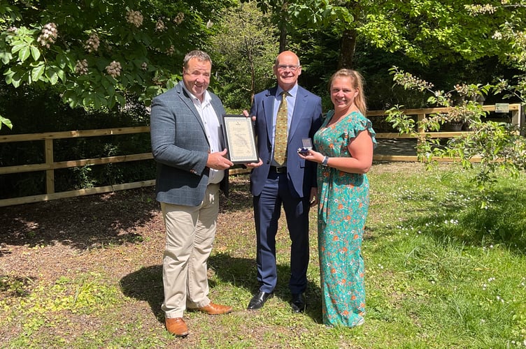 Lee and Jenni Percy receive the Silver Kite Award from Powys County Council Chairman Cllr Jonathan Wilkinson at the opening of the Chalybeate Tea Room