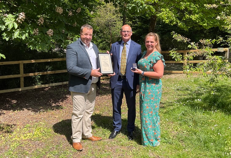Lee and Jenni Percy receive the Silver Kite Award from Powys County Council Chairman Cllr Jonathan Wilkinson at the opening of the Chalybeate Tea Room