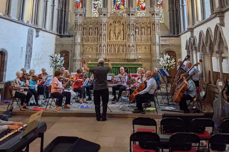 Gwent Chamber Orchestra rehearsing for a lunchtime concert at Brecon Cathedral in July 2022
