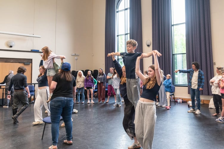The cast hard at work during rehearsals