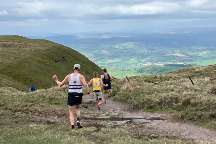Runners start the steep  descent in the Talgarth Fell Race