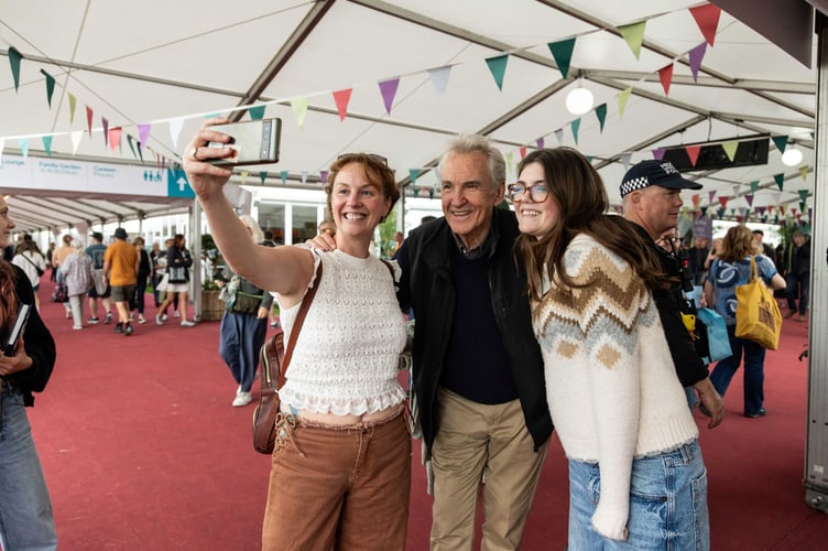 Actor Larry Lamb takes a selfie with fans after discussing his novel, All Wrapped Up, with Alex Clark at the 2025 Credit: Billie Charity and Hay Festival 2025.
