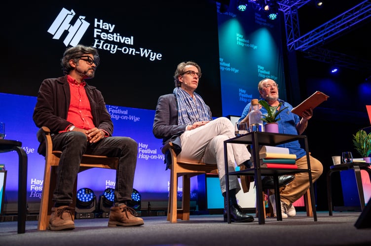 Indian essayist and novelist Pankaj Mishra and writer Benjamin Moser speak to historian William Dalrymple at the 2025 Hay Festival. Credit: Adam Tatton-Reid and Hay Festival.