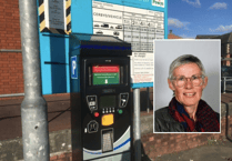 Powys car parks cost more than neighbouring authorities, a councillor claims