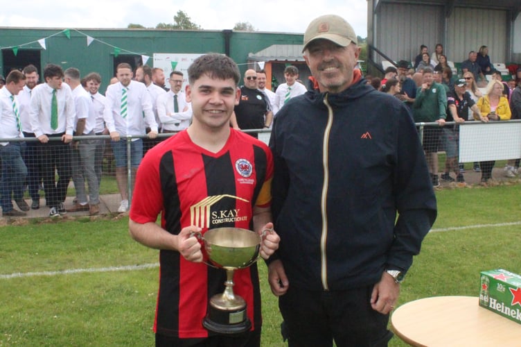 Martin Tong awards the Ron Ellis Cup and player of the match to Presteigne St Andrews' hat-trick star Sezer Cakmak 