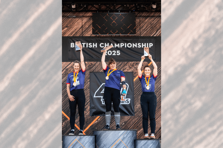 Rachel Ferrington (centre) celebrates on the podium after setting a new Women’s World Record at the 2025 British TIMBERSPORTS® Championship