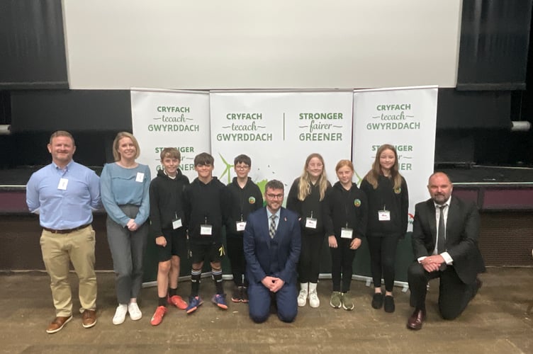 Pupils from Ysgol Golwg y Cwm alongside Cllr Matthew Dorrance; Dr Richard Jones, Powys County Council’s Director of Education; Simon Page and Kirsten Mackay from Child Poverty Action Group