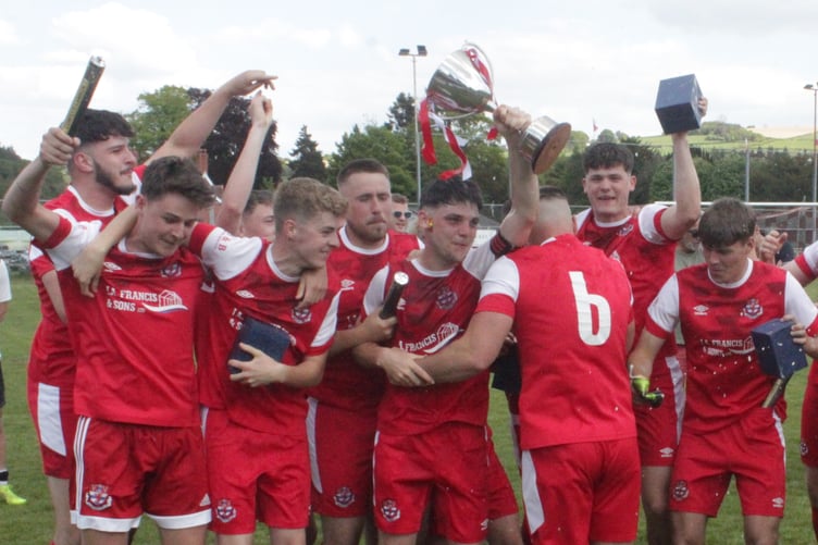 Knighton Town celebrating their title win last season. Their focus now shifts to their return to the third tier of Welsh football