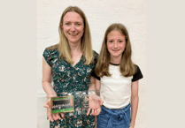 Rhayader choir honours devoted pianist with plaque at annual concert