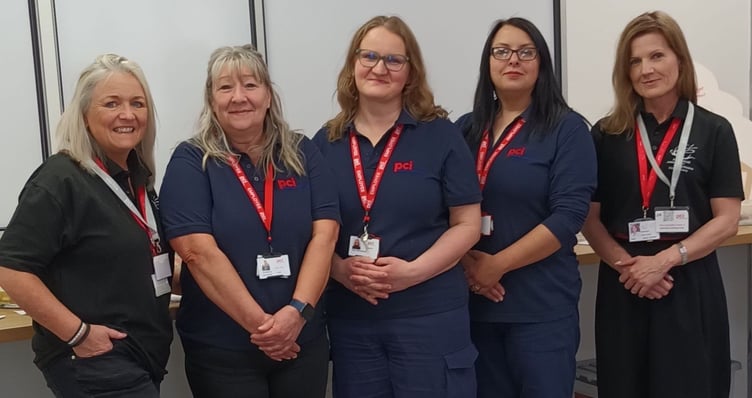 Left to right: Kate Thomas, Wales Air Ambulance’s Regional Fundraising Manager for Powys, PCI staff and coffee and cake organisers Becky Greenow, Ewa Mansfield, Izabela Grzybek, and the Charity’s Public Affairs Lead, Emma Grant