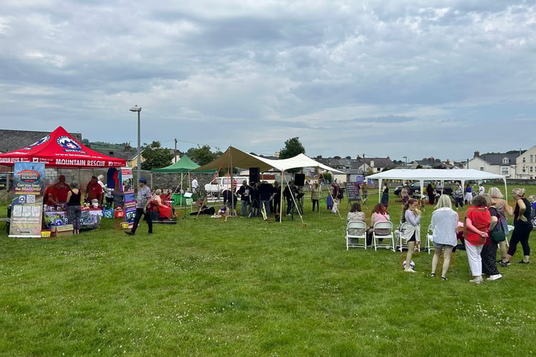 Families enjoy the sunshine and entertainment at the L’Arche Summer Fayre in Llanfaes Park, Brecon