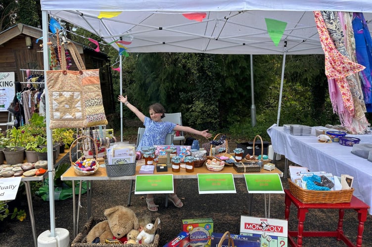 The youngest volunteer - Kathryn on the BT shop stall