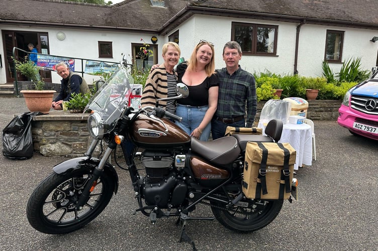 Bike winner - Tyler Roberts pictured with donors Christina and Graham Brownley