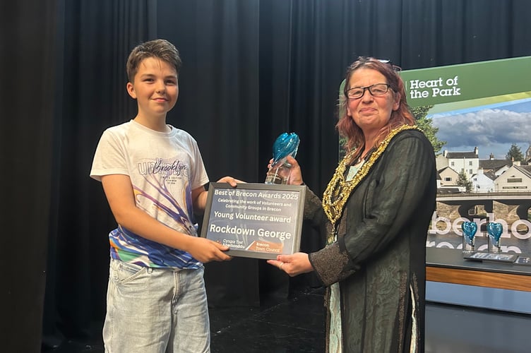 Cllr Marie Matthews presents the Young Volunteer Award to George Southgate