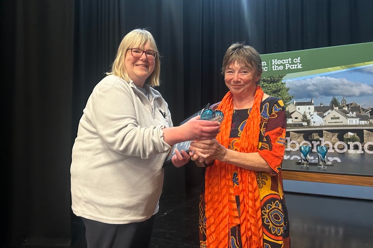 Cerian Martin receives the Trustee of the Year award from Cllr Sian Drinan
