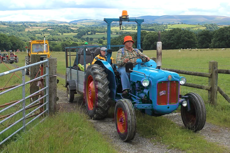 Llanyre's Mike Chandler with his father riding shotgun