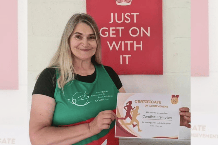 Caroline Frampton with her certificate for completing three miles every day for 30 days