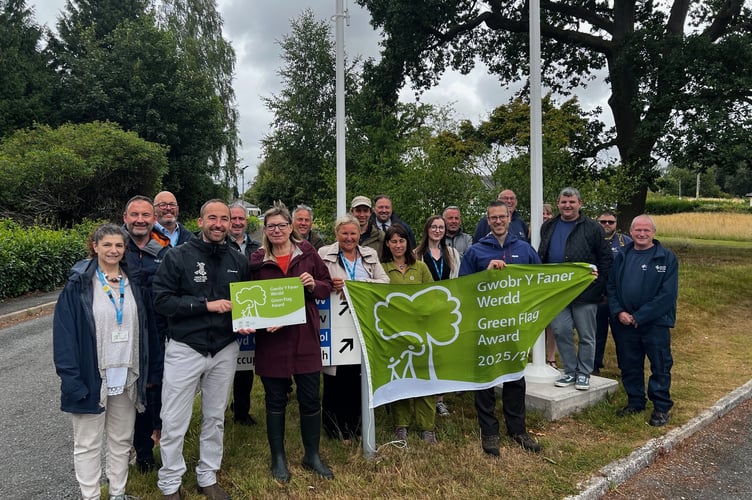 Staff celebrate Green Flag success at Bronllys Hospital with Claire Madsen of PTHB and Owen Derbyshire of Keep Wales Tidy