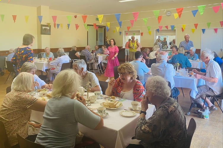 Guests enjoy afternoon tea at Llanigon Village Hall, hosted by Hay Dial-a-Ride