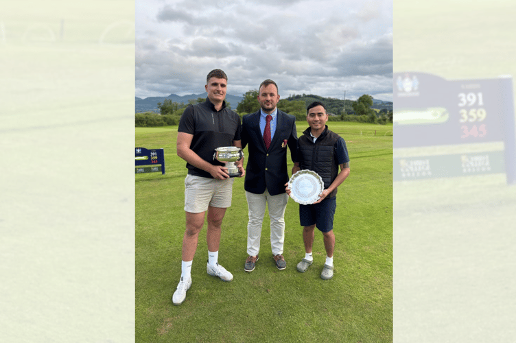 Rob Evans and Vivek Gurung with their trophies, presented by Cradoc Club Captain Chris Reeves
