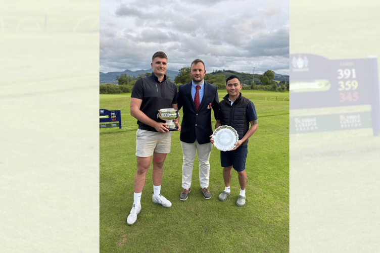 Rob Evans and Vivek Gurung with their trophies, presented by Cradoc Club Captain Chris Reeves