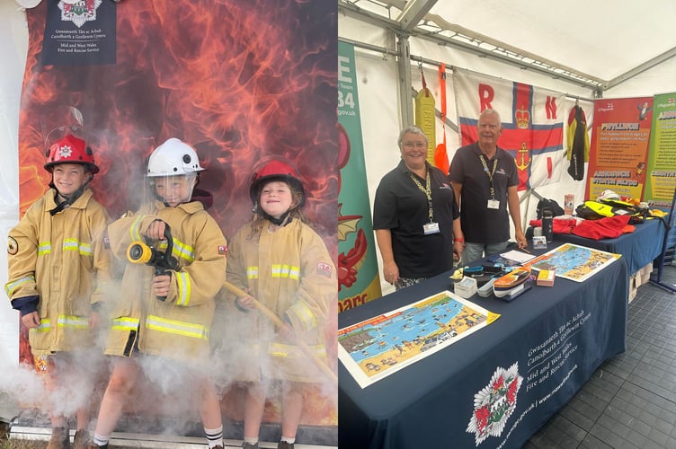 Children enjoy dressing up as firefighters at the Mid and West Wales Fire and Rescue Service stand