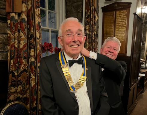 Past President David Haycock installs Hywel Bevan as Crickhowell Rotary President for 2025/26