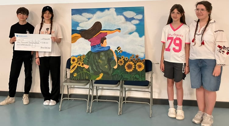 Max, Kameliia, Kseniia and Sofiia with their painting