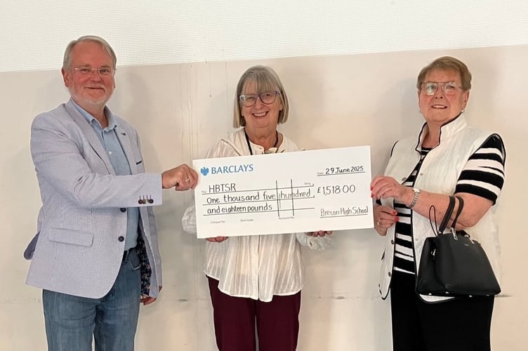 Geoff Lloyd, Margaret Blake and Vivienne Williams with the cheque