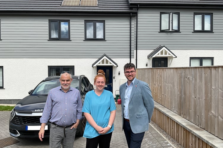 Cllr Matthew Dorrance (right) visits Courtney James to see how her family have settled into their new home. Also pictured is Andy Thompson, Powys Council’s Head of Housing