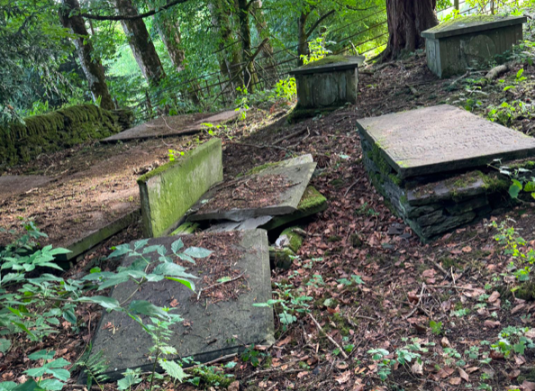 Vandalised graveyard Powys