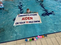 Incredible Aiden completes mammoth swim challenge for charity