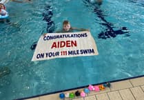 Incredible Aiden completes mammoth swim challenge for charity