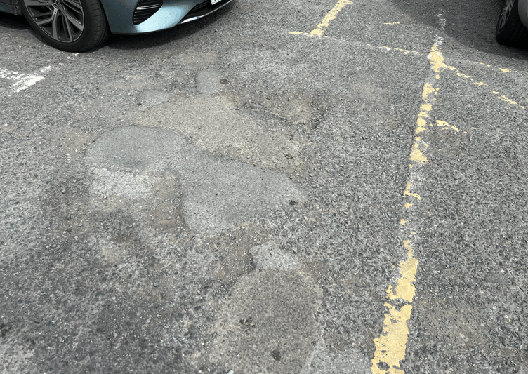 Questions have been raised to Powys County Council over the current condition of Market Square’s car park surface.
