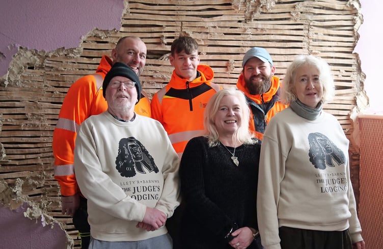 The Judge’s Lodging manager Gaby Rivers with builders and staff celebrate the first day of site work