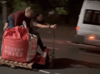 VIDEO: Two men ride a pallet truck down Brecon street