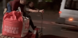 VIDEO: Two men ride a pallet truck down Brecon street