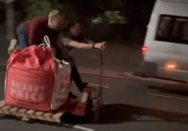 VIDEO: Two men ride a pallet truck down Brecon street