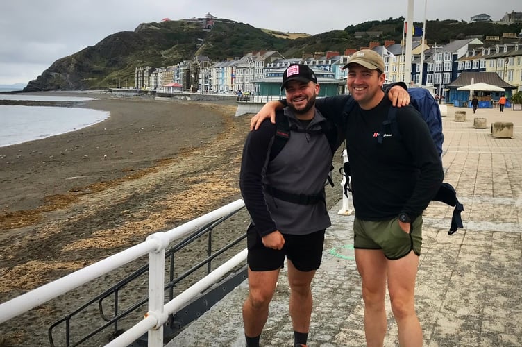 Toby Weale and walking partner setting off from Aberystwyth