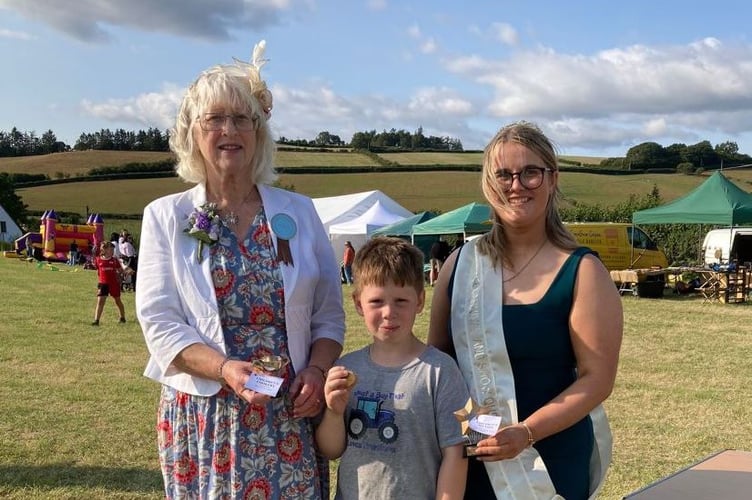 Show President Ruth Hargest with Children's section winner, Gwesyn Jones, and Show Queen, Llinos Jones
