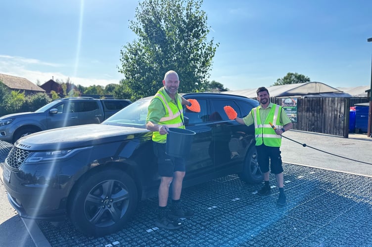 Staff at the Old Railway Line Garden Centre hard at work during their charity car wash